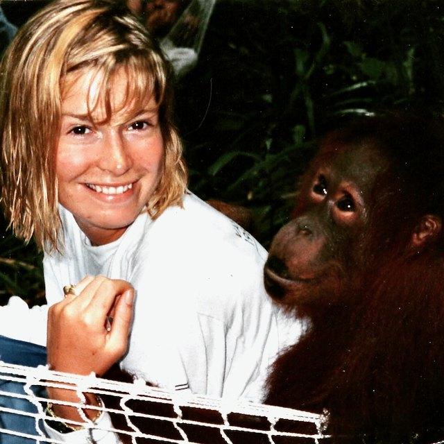 Amy McCrae Kessler with a juvenile orangutan, Borneo, 1992